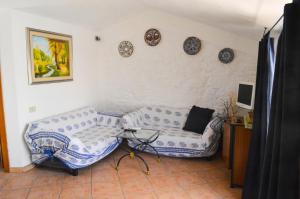 A television and/or entertainment centre at Casa Maria