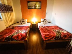 Giường trong phòng chung tại Nuwara Eliya Hills Rest