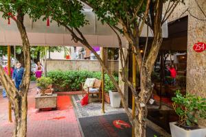 a group of trees in front of a building at Hotel Vermont Ipanema in Rio de Janeiro