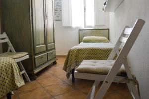 A bed or beds in a room at Casa Maria