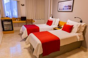 En eller flere senge i et værelse på Hotel Vermont Ipanema