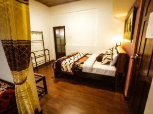 Giường trong phòng chung tại Nuwara Eliya Hills Rest