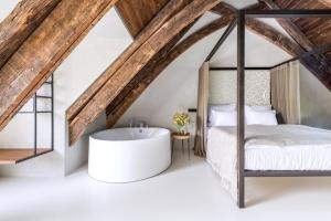 Voodi või voodid majutusasutuse Yard Resort toas