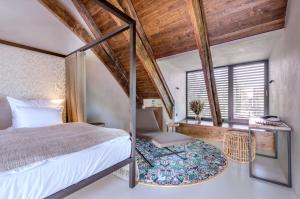 Voodi või voodid majutusasutuse Yard Resort toas