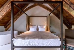 Voodi või voodid majutusasutuse Yard Resort toas