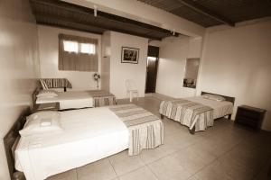 a hotel room with two beds in a room at Nasca Trails B&B in Nazca