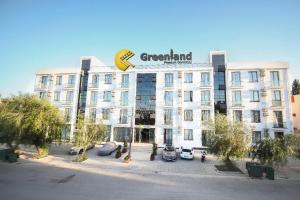 a large white building with a sign on it at Greenland Premium Residance in Lefkosa Turk