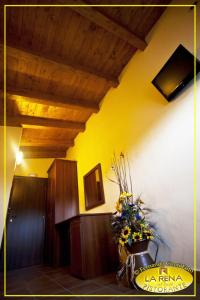 a hallway with a vase of flowers in a room at Villa La Rena in Anagni