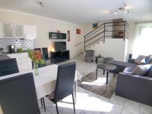 A kitchen or kitchenette at Biro Apartman
