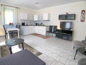 A kitchen or kitchenette at Biro Apartman