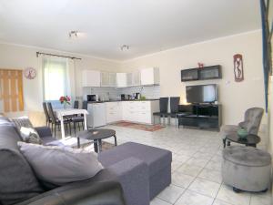 A kitchen or kitchenette at Biro Apartman