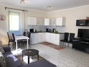 A kitchen or kitchenette at Biro Apartman
