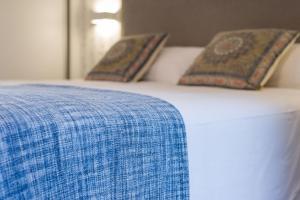 Postel nebo postele na pokoji v ubytování Hotel A Curuxa Wellness + 25 fotografií