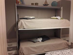 Ένα ή περισσότερα κρεβάτια σε δωμάτιο στο casa Fantulìn Mare