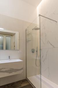 a bathroom with a shower and a sink at Relais Mareluna - Luxury Apartments in Salerno