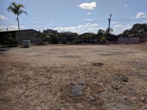 
a dirt field with a car parked in it at Best One Motel in Rockhampton
