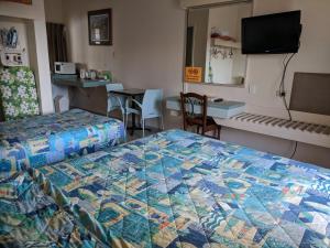 Postel nebo postele na pokoji v ubytování Best One Motel