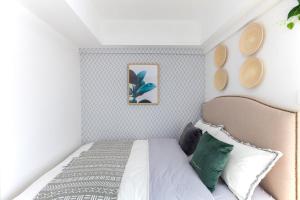 Un pat sau paturi într-o cameră la Wuhan Wuchang·Hualin Huabu Lane· Locals Apartment 00142780