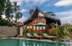 Foto da galeria de Benisari Batik Garden Cottage em Ubud
