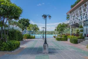 a street light on a sidewalk next to a building at @The Pier 519 Hostel in Phi Phi Islands