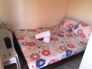Postel nebo postele na pokoji v ubytování Edem Tourist Inn Malapascua