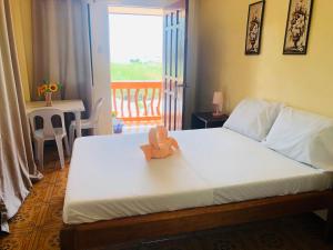 Postel nebo postele na pokoji v ubytování Edem Tourist Inn Malapascua