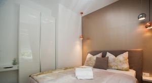 Posteľ alebo postele v izbe v ubytovaní Citylux Apartments