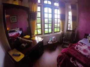 Giường trong phòng chung tại Nuwara Eliya Hills Rest