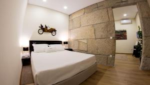 Ένα ή περισσότερα κρεβάτια σε δωμάτιο στο Bugalha My Loft Douro 8