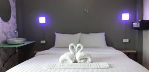 Ein Bett oder Betten in einem Zimmer der Unterkunft Thapae Gate Lodge
