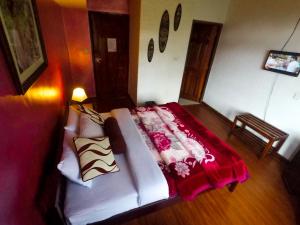 Giường trong phòng chung tại Nuwara Eliya Hills Rest