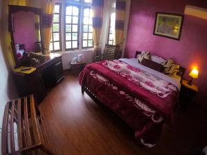 Giường trong phòng chung tại Nuwara Eliya Hills Rest
