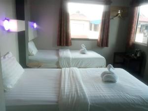 Ein Bett oder Betten in einem Zimmer der Unterkunft Thapae Gate Lodge