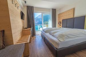 Postel nebo postele na pokoji v ubytování Hotel Fontanella