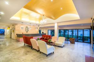 a lobby of a hospital with a couch and chairs at Bella Villa Metro in Pattaya North +124 photos