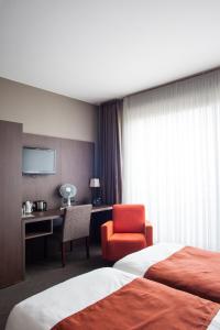 Postel nebo postele na pokoji v ubytování Hotel Rastelli Tervuren + 19 fotografií