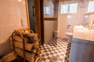 a bathroom with a sink and a toilet and a counter at Villa Helga - Beachfront in Hitis +40 photos