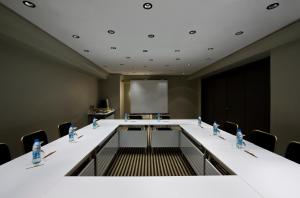 a conference room with a long table and chairs at The Marmara Sisli in Istanbul