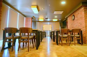 a dining room with a table and chairs in a room at Sarajevo Suit Hotel in Kocaeli