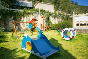 a group of playground equipment on the grass at Royal Bay Hotel - All Inclusive in Elenite