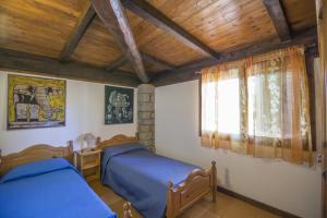a bedroom with two beds and a window at Campeggio Villaggio Sos Flores in Tortolì +243 photos