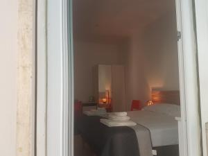Postel nebo postele na pokoji v ubytování Parfumerie 5 Terre
