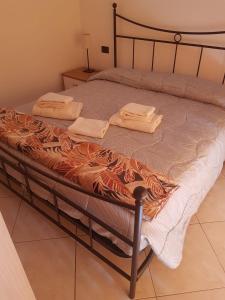 Postel nebo postele na pokoji v ubytování Caravaggio Apartments
