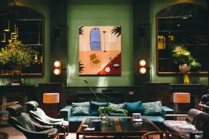 a living room with a couch and a table at Hotel Casa Bonay & Spa in Barcelona