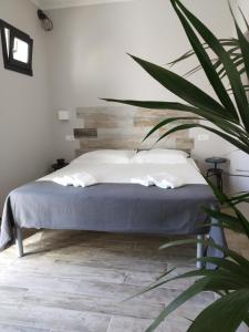 Кровать или кровати в номере Dimora "I Santi Patroni"