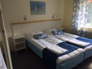 Voodi või voodid majutusasutuse Hotell Paradis toas