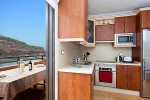 a kitchen with a view of the ocean at San Marcos Frontline in Icod de los Vinos