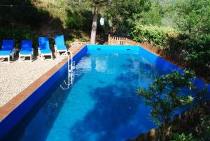 The swimming pool at or close to Masia El Canalot - Molí Del Pont