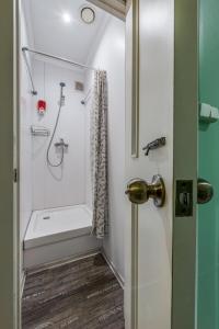 a bathroom with a shower, toilet and sink at Hostel Mayakovsky in Moscow