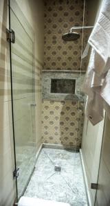 a shower with a glass door in a bathroom at Junior Suite Balima I B43 in Rabat